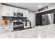 Modern kitchen with new appliances and white cabinets with granite countertops at 1213 Fairview Dr, Greenfield, IN 46140