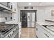 Modern kitchen with stainless appliances, washer/dryer and pantry at 1213 Fairview Dr, Greenfield, IN 46140