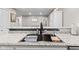 Granite counters and stainless sink in this modern kitchen at 1213 Fairview Dr, Greenfield, IN 46140