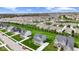 An aerial view of a residential neighborhood featuring well-maintained homes and green spaces at 12902 Girvan Way, Fishers, IN 46037