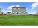 The backyard has a well kept lawn with a fence between the homes at 12902 Girvan Way, Fishers, IN 46037