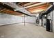 Unfinished basement with exposed ceiling, a support beam, and poured concrete floors at 12902 Girvan Way, Fishers, IN 46037