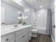 Clean bathroom features double vanity, white cabinets, and shower-tub combination with grey accents at 12902 Girvan Way, Fishers, IN 46037