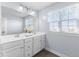 Well-lit bathroom featuring a double vanity, large mirror, and a bright, airy feel at 12902 Girvan Way, Fishers, IN 46037