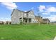 Beautiful two-story home in a Gathering-friendly neighborhood with a manicured lawn at 12902 Girvan Way, Fishers, IN 46037