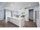 Bright, modern kitchen featuring a large island, stainless steel appliances, and pendant lighting at 12902 Girvan Way, Fishers, IN 46037