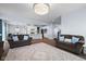 Open-concept living room and kitchen with modern furnishings and stylish decor at 12902 Girvan Way, Fishers, IN 46037