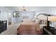 Cozy main bedroom with a flat-screen TV, large window, and stylish nightstands with lamps at 12902 Girvan Way, Fishers, IN 46037