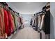 Large walk-in closet with organized shelving and hanging space for an extensive wardrobe collection at 12902 Girvan Way, Fishers, IN 46037
