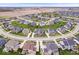 Expansive aerial view showcasing a neighborhood with well-maintained lawns and diverse home styles at 1352 Trifecta Way, Westfield, IN 46074