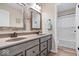 Bathroom features a double vanity with framed mirrors, updated fixtures, and a separate shower area at 1352 Trifecta Way, Westfield, IN 46074