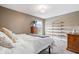 Primary bedroom with an oversized ceiling fan, and a large window at 1352 Trifecta Way, Westfield, IN 46074