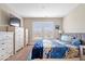 Cozy bedroom with plush carpet, double windows, and ample storage space at 1352 Trifecta Way, Westfield, IN 46074