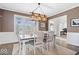 Inviting dining room featuring a modern light fixture and a stylish, neutral color palette at 1352 Trifecta Way, Westfield, IN 46074