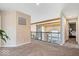 Upstairs hallway with exposed wood beams and iron railing overlooking the living area below at 1352 Trifecta Way, Westfield, IN 46074