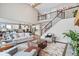 Open-concept living room showcases a modern design with hardwood floors and seamless kitchen access at 1352 Trifecta Way, Westfield, IN 46074