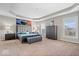 Spacious main bedroom with tray ceilings, neutral carpet, and expansive windows at 1352 Trifecta Way, Westfield, IN 46074