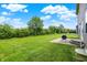 Spacious backyard featuring a large lawn and a patio area perfect for outdoor entertaining and relaxation at 13567 Moorcroft Dr, Fishers, IN 46037