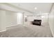 Finished basement with carpet flooring and a leather couch at 13567 Moorcroft Dr, Fishers, IN 46037