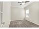 Empty bedroom with carpeted floors, a ceiling fan, a double door entry and natural light at 13567 Moorcroft Dr, Fishers, IN 46037