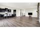 Spacious open-concept living area with a modern kitchen and fireplace creating an inviting atmosphere at 13567 Moorcroft Dr, Fishers, IN 46037