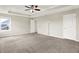 Bright main bedroom with neutral walls, carpet floors, and ample natural light from the window at 13567 Moorcroft Dr, Fishers, IN 46037