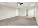 Spacious main bedroom boasts tray ceilings and a ceiling fan for added comfort and style at 13567 Moorcroft Dr, Fishers, IN 46037