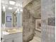 Unique bathroom design featuring patterned wallpaper and a well-lit vanity at 13587 Kensington Pl, Carmel, IN 46032