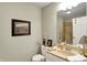 Bright bathroom with neutral tones, framed artwork, and vanity with sink at 13587 Kensington Pl, Carmel, IN 46032