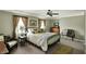 Bedroom features a comfortable bed with patterned pillows and natural light from windows at 13587 Kensington Pl, Carmel, IN 46032
