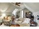Attic space with comfortable seating and a view to the stairwell at 13587 Kensington Pl, Carmel, IN 46032