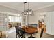 Open concept dining room with views into the living room and kitchen, offering a seamless flow at 13587 Kensington Pl, Carmel, IN 46032