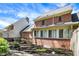 Exterior view of a brick home with a backyard, landscaping, and a stone pathway at 13587 Kensington Pl, Carmel, IN 46032