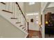 Inviting foyer with hardwood floors, a staircase, and a bright entryway at 13587 Kensington Pl, Carmel, IN 46032