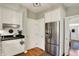 Efficient kitchen with stainless steel refrigerator and functional layout at 13587 Kensington Pl, Carmel, IN 46032