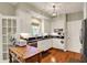 Bright kitchen with stainless steel appliances, wooden floors, and a cozy atmosphere at 13587 Kensington Pl, Carmel, IN 46032