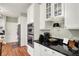 Bright kitchen features white cabinets, granite countertops, and stainless steel appliances at 13587 Kensington Pl, Carmel, IN 46032