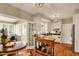 Open-concept kitchen features a dining area and access to a sunroom at 13587 Kensington Pl, Carmel, IN 46032