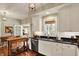 Well-appointed kitchen with black countertops, stainless appliances, and eat-in area at 13587 Kensington Pl, Carmel, IN 46032