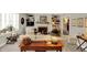 Bright and open living room featuring a fireplace, built-in shelving, and a comfortable seating area at 13587 Kensington Pl, Carmel, IN 46032