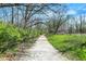 Picturesque walking path through lush greenery, providing a peaceful escape into nature at 13587 Kensington Pl, Carmel, IN 46032