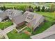 Aerial view of the home featuring a brick and vinyl exterior, attached garage, and landscaped surroundings at 1361 Trescott Dr, Westfield, IN 46074