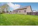 Expansive backyard featuring a well-kept lawn, wood fence, and a deck, perfect for outdoor enjoyment at 1361 Trescott Dr, Westfield, IN 46074