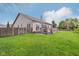 Spacious backyard with green grass, wood fence, and a wooden deck, ideal for entertaining or relaxation at 1361 Trescott Dr, Westfield, IN 46074