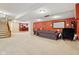 Expansive finished basement featuring plush carpeting, and an adjacent wet bar at 1361 Trescott Dr, Westfield, IN 46074