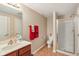 Well-lit bathroom featuring a tiled floor, shower, and a vanity at 1361 Trescott Dr, Westfield, IN 46074