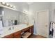 Bathroom with double sinks, ample lighting, framed mirrors, and a neutral color scheme at 1361 Trescott Dr, Westfield, IN 46074