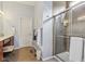 Tiled bathroom features a glass-enclosed shower and plenty of vanity counter space at 1361 Trescott Dr, Westfield, IN 46074