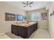 Cozy bedroom featuring neutral walls, carpet, ceiling fan, and a bright window at 1361 Trescott Dr, Westfield, IN 46074