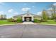 Community clubhouse featuring a welcoming entrance, white columns, and professionally landscaped gardens at 1361 Trescott Dr, Westfield, IN 46074